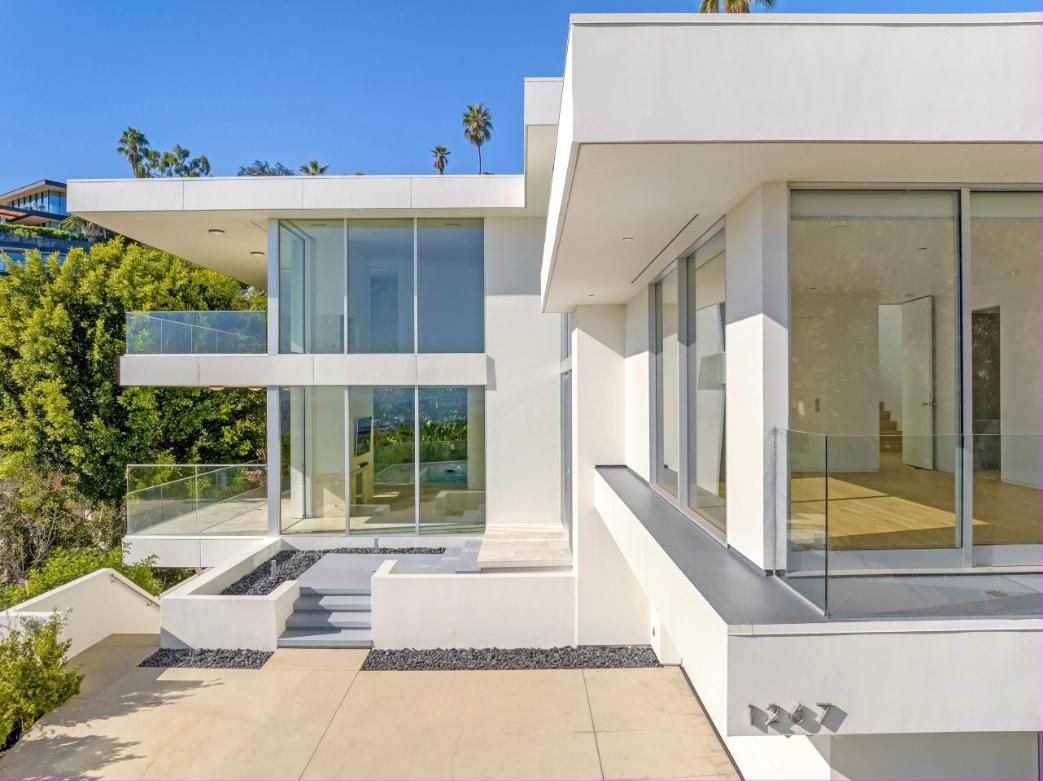 Modern hillside residence with glass walls